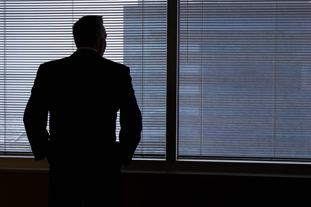 Man staring out a window